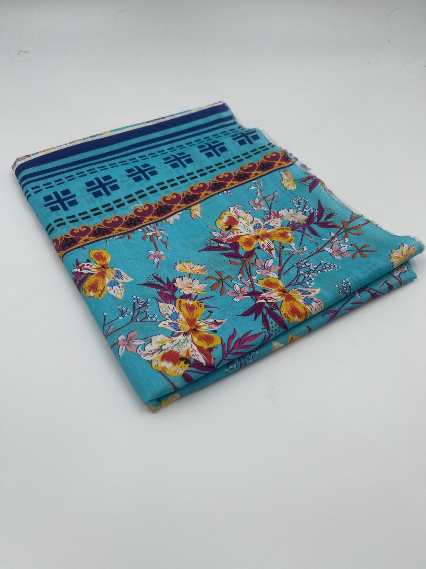 Folded fabric with floral pattern on a white background